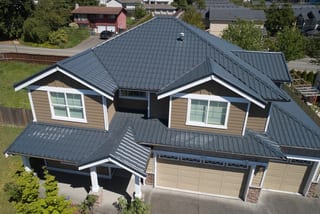 Deep Charcoal Interlock Tile aluminum roof on a two-storey home with a metal roof and a large front yard, Lynnwood, Washington