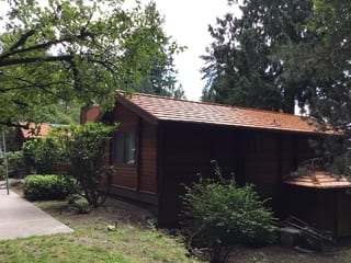 Copper Penny Interlock Shake aluminum roof on a brown single-family home with a copper penny metal roof, Bainbridge Island, Washington