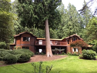 Copper Penny Interlock Shake aluminum roof on a modern home with a copper penny metal roof in a forested, Bainbridge Island, Washington