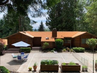 Copper Penny Interlock Shake aluminum roof on a brown ranch style home with a copper penny metal roof in, Bainbridge Island, Washington