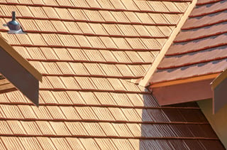 Copper Penny Interlock Shake aluminum roof on a modern home with a copper penny metal roof in a rural area, Bellingham, Washington
