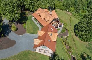 Copper Penny Interlock Shake aluminum roof on a single-storey home with a copper penny metal roof in a, Bellingham, Washington