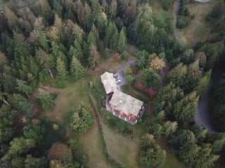 Before: a worn out clay tile roof on the home, Bellingham, Washington, ahead of a Copper Penny Interlock Shake aluminum roof