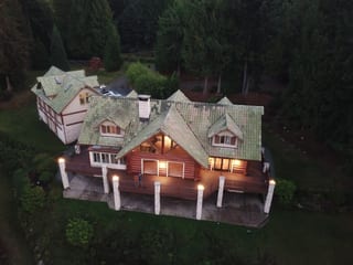 Before: a worn out clay tile roof on the home, Bellingham, Washington, ahead of a Copper Penny Interlock Shake aluminum roof