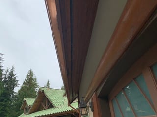 Before: a worn out clay tile roof on the home, Bellingham, Washington, ahead of a Copper Penny Interlock Shake aluminum roof