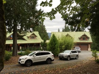 Before: a worn out clay tile roof on the home, Bellingham, Washington, ahead of a Copper Penny Interlock Shake aluminum roof