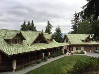 Before: a worn out clay tile roof on the home, Bellingham, Washington, ahead of a Copper Penny Interlock Shake aluminum roof