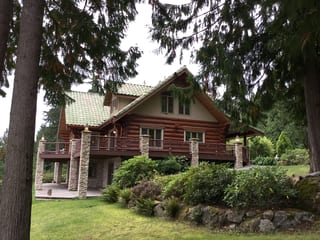 Before: a worn out clay tile roof on the home, Bellingham, Washington, ahead of a Copper Penny Interlock Shake aluminum roof