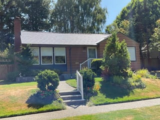 Deep Charcoal Interlock Cedar Shingle aluminum roof on a brown one-storey home with a metal roof in a suburban, Seattle, Washington