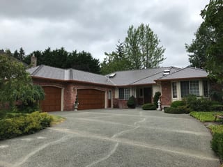 Tudor Brown Interlock Cedar Shingle aluminum roof on a Tudor Brown metal roof on a ranch style home in a, Mill Creek, Washington