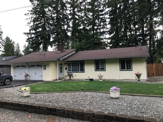 Before: a worn out asphalt shingle roof on the home, Kent, Washington, ahead of a Deep Charcoal Interlock Shake aluminum roof