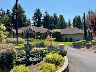 Before: a concrete tile roof with broken tiles on the home, Auburn, Washington, ahead of a Copper Penny Interlock Shake aluminum roof