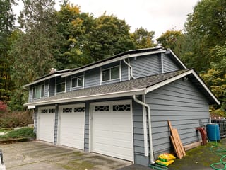 Before: a worn out asphalt shingle roof on the home, Woodinville, Washington, ahead of a Deep Charcoal Interlock Slate aluminum roof