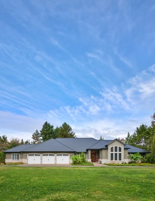 Black Interlock Slate aluminum roof on a modern single-family home with a black metal roof in a, Ridgefield, Washington