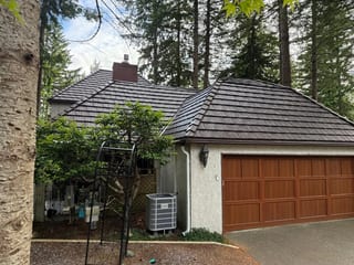 Colonial Brown Interlock Shake aluminum roof on a Colonial home with a brown metal roof in a forested rural, Bellingham, Washington