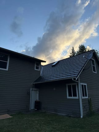 Black Interlock Shake aluminum roof on a two-storey Interlock Shake aluminum roof in black on a, Marysville, Washington
