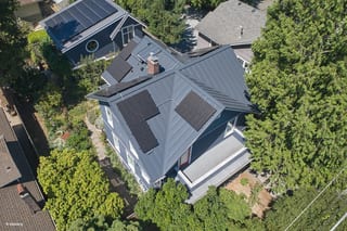 Deep Charcoal Interlock Standing Seam aluminum roof on a modern house with a deep charcoal metal roof in a, Seattle, Washington