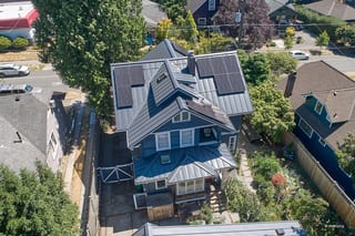 Deep Charcoal Interlock Standing Seam aluminum roof on a Deep Charcoal metal roof on a two-storey craftsman home, Seattle, Washington