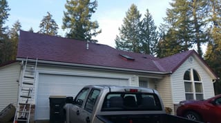 Tile Red Interlock Slate aluminum roof being installed on the home, replacing an asphalt shingle roof being torn off, Olympia, Washington