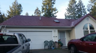 Tile Red Interlock Slate aluminum roof on a beige single-storey ranch with a red metal roof among, Olympia, Washington