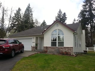 Before: a worn out asphalt shingle roof on the home, Olympia, Washington, ahead of a Tile Red Interlock Slate aluminum roof