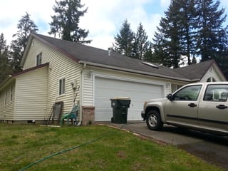 Before: a worn out asphalt shingle roof on the home, Olympia, Washington, ahead of a Tile Red Interlock Slate aluminum roof