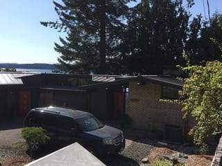 Musket Grey Interlock Standing Seam aluminum roof on a brick ranch style home on a waterfront property, Belfair, Washington