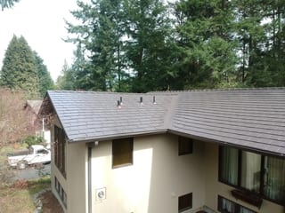 Tudor Brown Interlock Slate aluminum roof on a Tudor Brown metal roof on a two-storey ranch home in the, University Place, Washington