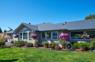 Deep Charcoal Interlock Slate aluminum roof on a deep charcoal ranch home with a metal roof in a rural area, Sequim, Washington