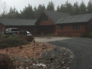 Before: a worn out asphalt shingle roof on the home, Olympia, Washington, ahead of a Deep Charcoal Interlock Cedar Shingle aluminum roof