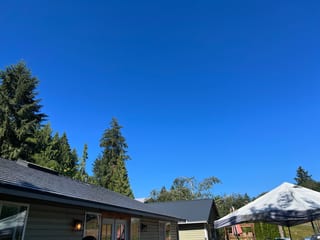 Deep Charcoal Interlock Cedar Shingle aluminum roof on a single-storey home with a deep charcoal metal roof in a, Longview, Washington