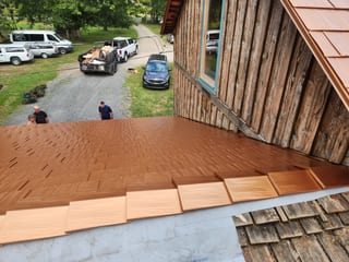 Copper Penny Interlock Cedar Shingle aluminum roof being installed on the home, replacing a worn out wood shake roof, Everson, Washington