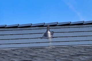 Black Interlock Slate aluminum roof on a black metal roof on a two-storey suburban home, Enumclaw, Washington