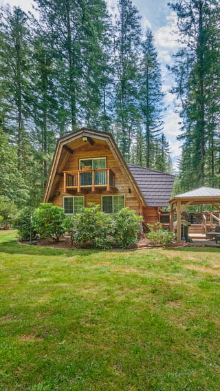 Colonial Brown Interlock Shake aluminum roof on a brown A-frame home with a Colonial Brown metal roof in a, Yacolt, Washington