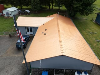 Copper Penny Interlock Slate aluminum roof on a grey home with an Interlock Slate roof in Copper Penny, Castle Rock, Washington