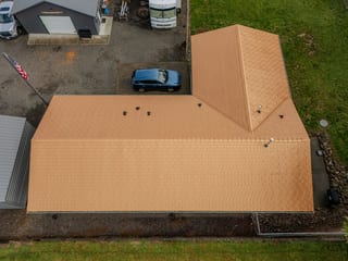 Copper Penny Interlock Slate aluminum roof on a ranch-style home with a copper penny metal roof in a, Castle Rock, Washington