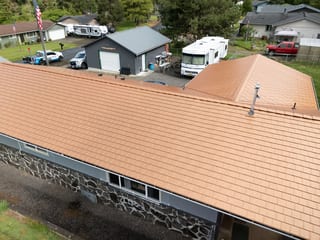 Copper Penny Interlock Slate aluminum roof on a ranch-style home with a copper penny metal roof in a, Castle Rock, Washington