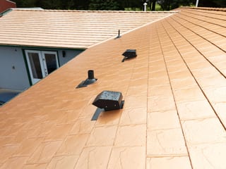 Copper Penny Interlock Slate aluminum roof on a Copper Penny metal roof on a single-family suburban home, Castle Rock, Washington