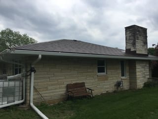 Colonial Brown Interlock Slate aluminum roof on a colonial brown metal roof on a single-story ranch home in, Kewaskum, Wisconsin