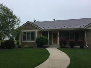Colonial Brown Interlock Slate aluminum roof on a colonial brown ranch style home in a rural setting, Port Washington, Wisconsin