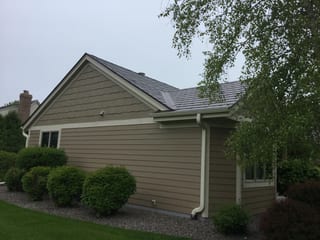 Colonial Brown Interlock Slate aluminum roof on a brown single-family home with a Colonial style and, Port Washington, Wisconsin