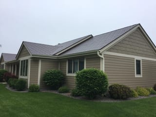Colonial Brown Interlock Slate aluminum roof on a Colonial home with Colonial Brown metal roof on a rural, Port Washington, Wisconsin