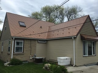 Aged Copper Interlock Slate aluminum roof on a single-family ranch home with a metal roof in a rural, Milwaukee, Wisconsin
