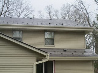 Tudor Brown Interlock Slate aluminum roof on a two-storey Tudor brown metal roof home in Delafield,, Delafield, Wisconsin