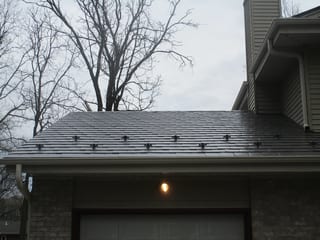 Tudor Brown Interlock Slate aluminum roof on a Tudor Brown metal roof on a Colonial style home in a, Delafield, Wisconsin