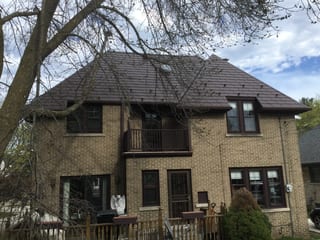 Colonial Brown Interlock Slate aluminum roof on a Colonial home with a brown metal roof in a forested urban, Milwaukee, Wisconsin