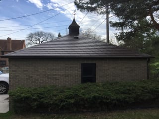 Colonial Brown Interlock Slate aluminum roof on a Colonial brown metal roof on a brick home in a, Milwaukee, Wisconsin