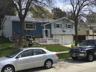 Weathered Interlock Slate aluminum roof on a two-storey home with dormers and a metal roof in a, Sheboygan, Wisconsin