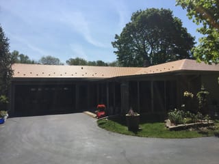 Aged Copper Interlock Slate aluminum roof on a ranch-style home with an Aged Copper metal roof in a, Colgate, Wisconsin