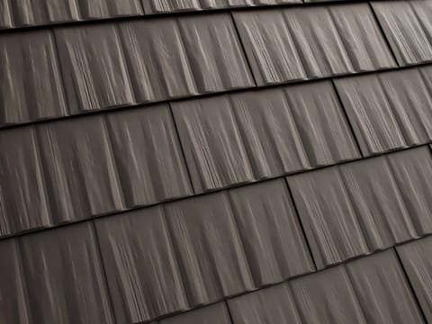 Close-up of Interlock cedar-style metal roofing shingles in Rosemont, Maine